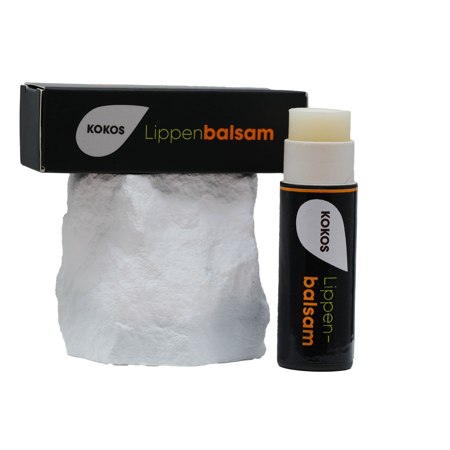 Lippenpflege Stift KOKOS mit Verpackung auf Stein 