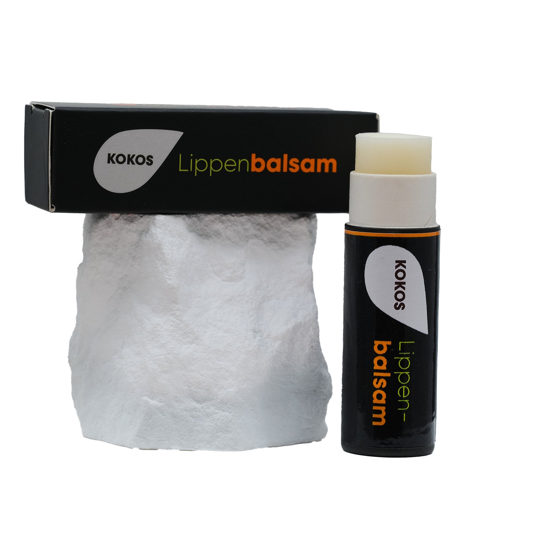Lippenpflege Stift KOKOS mit Verpackung auf Stein 